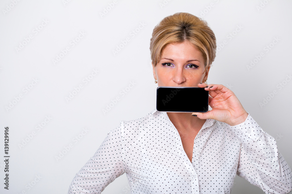 Fototapeta premium Young business woman shows on your phone