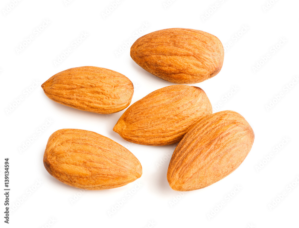 Five almonds nuts isolated on white background with clipping path. Top view. Macro. Five almonds nuts isolated on white background with clipping path. Top view. Macro.