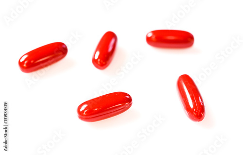 five red pills on a white background. medical abstract