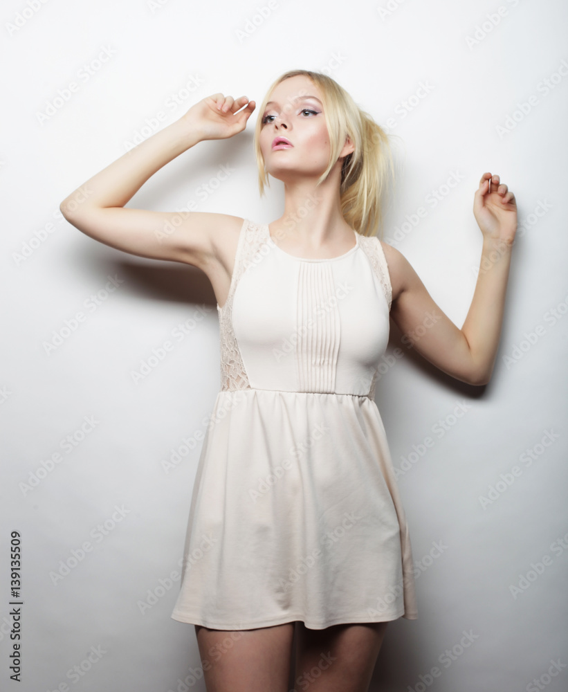 Naklejka premium young magnificent woman in white dress.