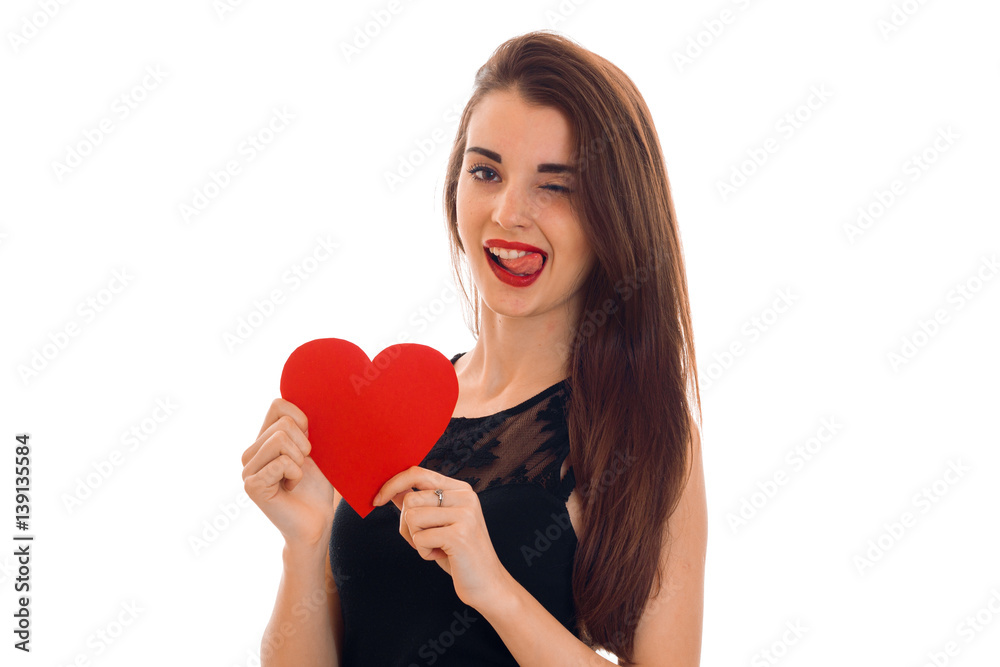 beautiful girl with red lipstick on lips holding a postcard sweetheart and winks beautiful girl with red lipstick on lips holding a postcard sweetheart and winks