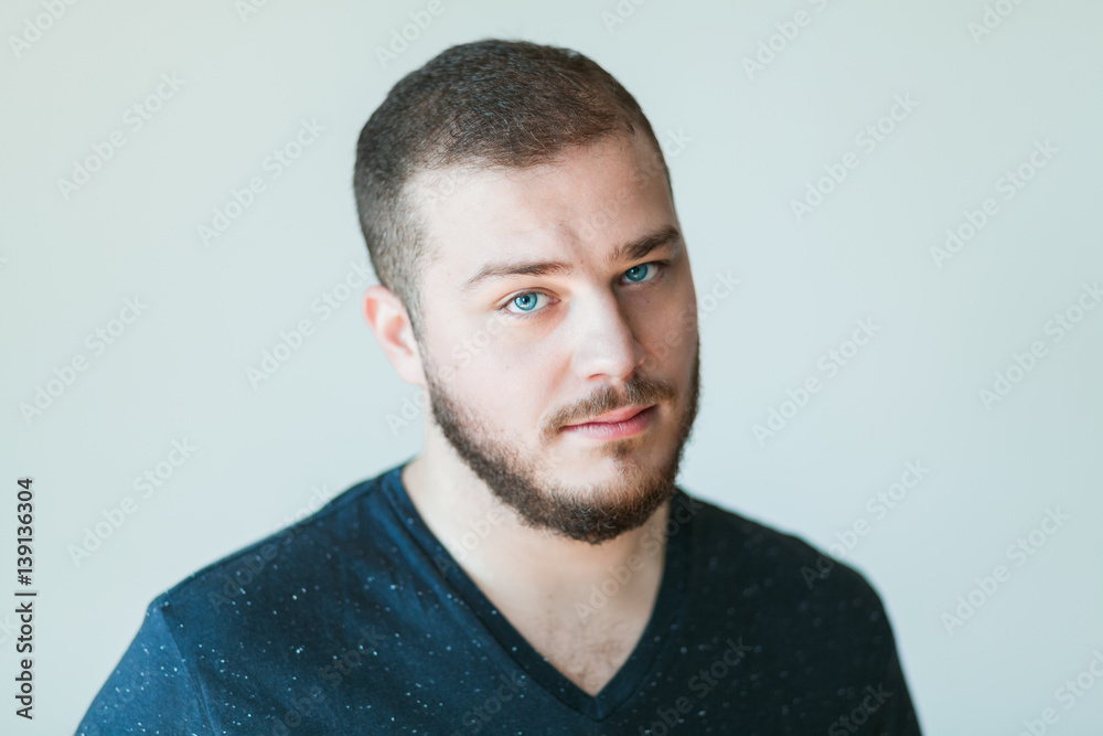 Fototapeta premium Portrait of a handsome bearded young man