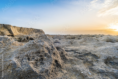 Erosion on the rocky surface, sunset with view on rocky ciffs. photo