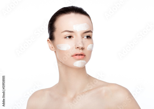 Beauty woman girl with face cream natural makeup