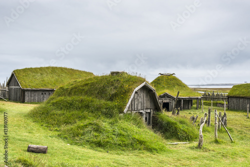 Typical Viking's village. Wooden houses near Vestrahorn mountains on the Stokksnes Peninsula, Hofn, Iceland photo