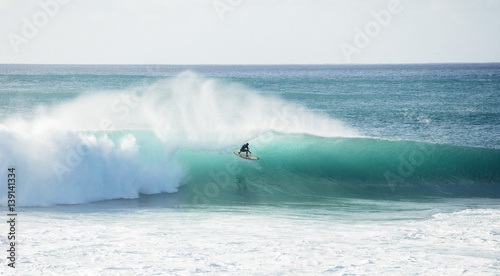 Person surfing on wave photo