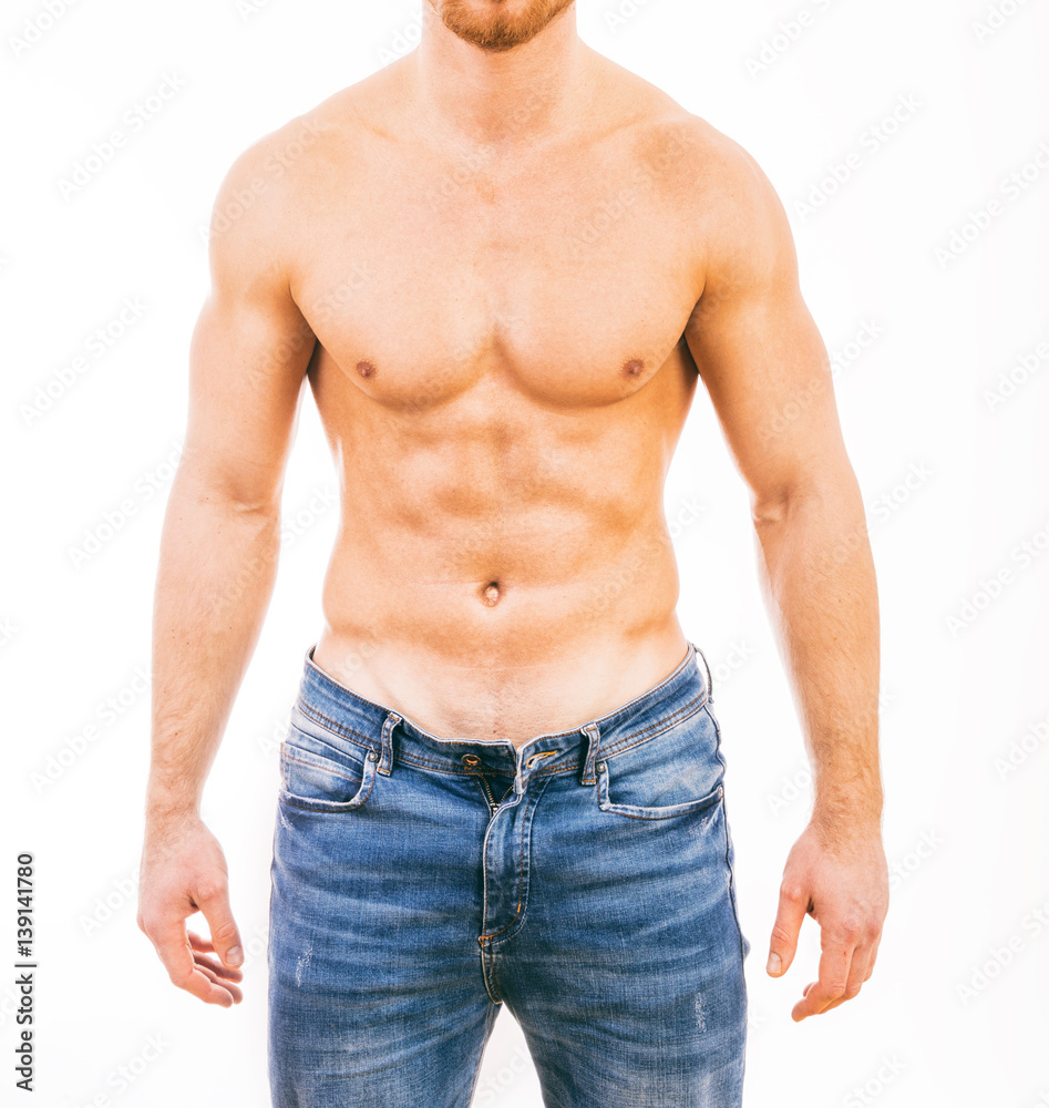 Muscular young man wearing jeans Isolated on white background.