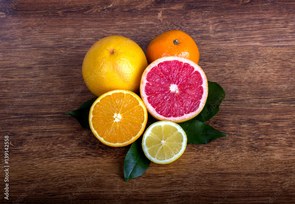 citrus fruit (slice lemon, slice orange, slice grapefruit and tangerine) with leaves citrus fruit (slice lemon, slice orange, slice grapefruit and tangerine) with leaves