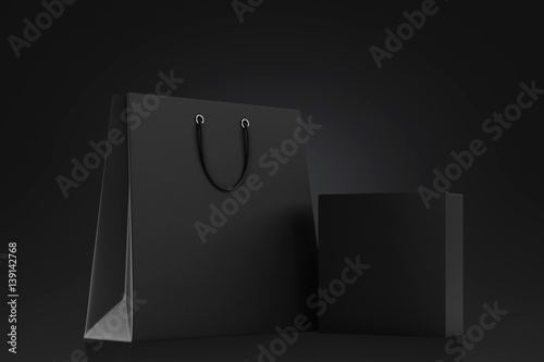 Black shopping bag and blank box on a black background. Mock up. 3d rendering