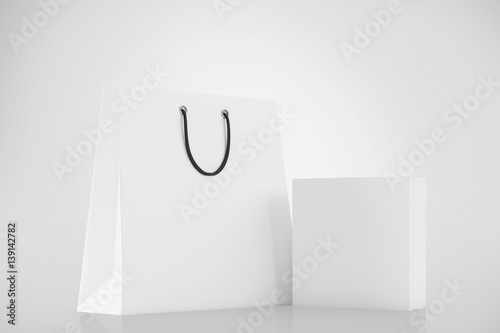 White blank box and shopping bag on a white background. Mock up. 3d rendering