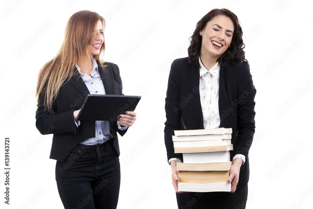 Beauty young business women with E-Book vs Books Beauty young business women with E-Book vs Books