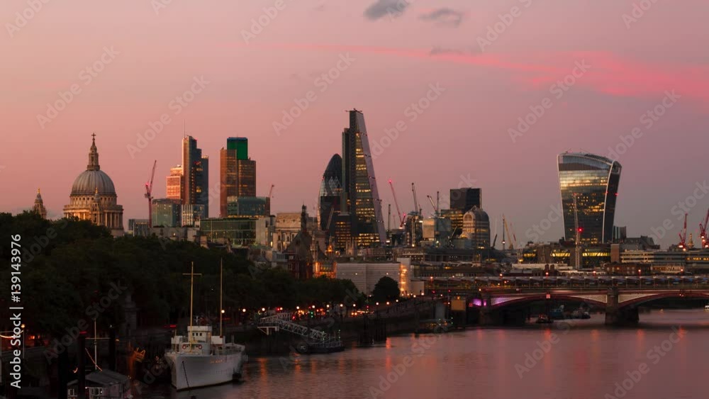 City of London TIme-Lapse at sunset with red and purple sky and clouds. Slow transition to the night blue sky.
With the St Paul's cathedral. City of London TIme-Lapse at sunset with red and purple sky and clouds. Slow transition to the night blue sky.
With the St Paul's cathedral.