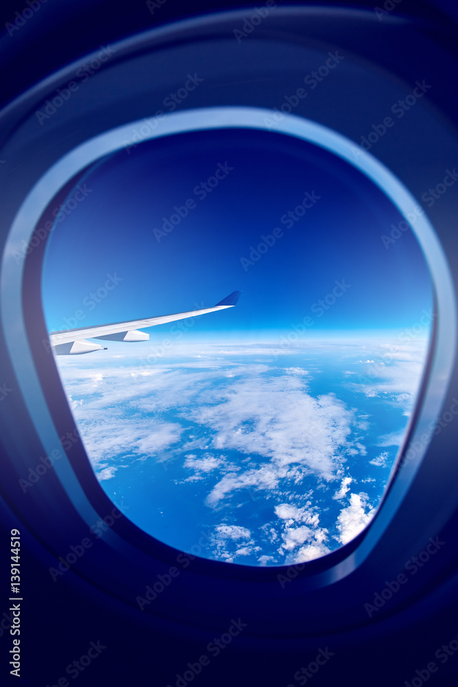 View from airplane window on the sea and clouds View from airplane window on the sea and clouds