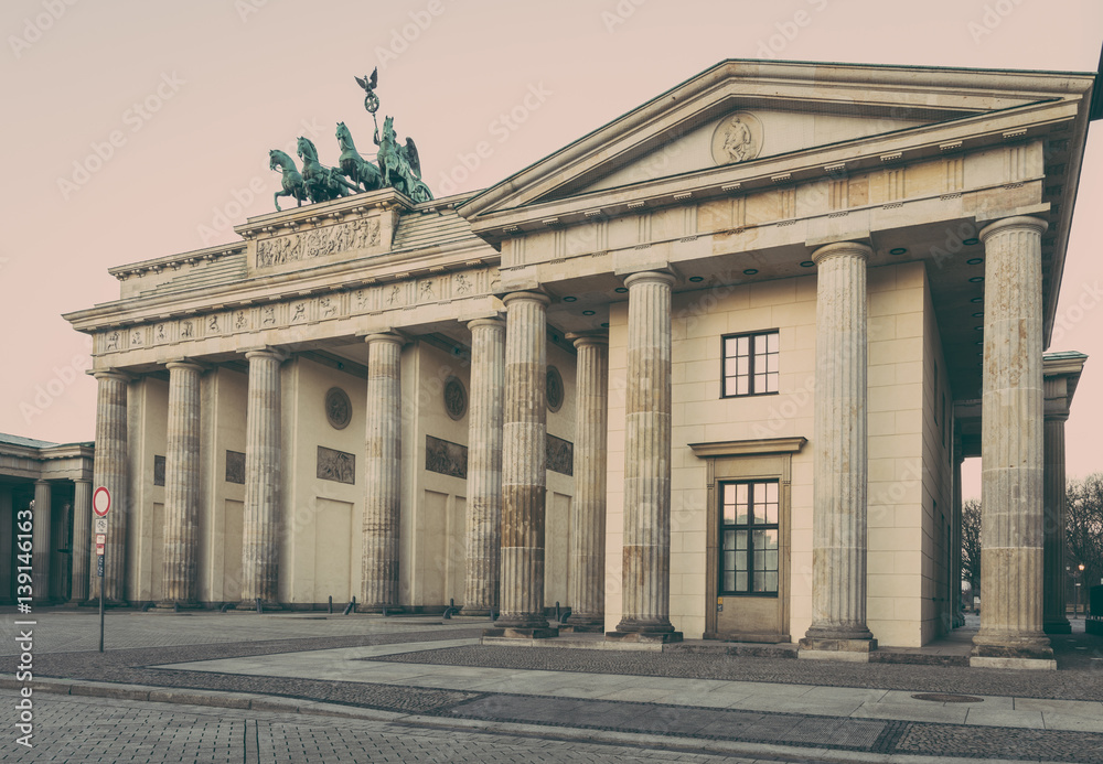 Sunrise at the Brandenburg Gate in Berlin, Germany in February, vintage filtered style