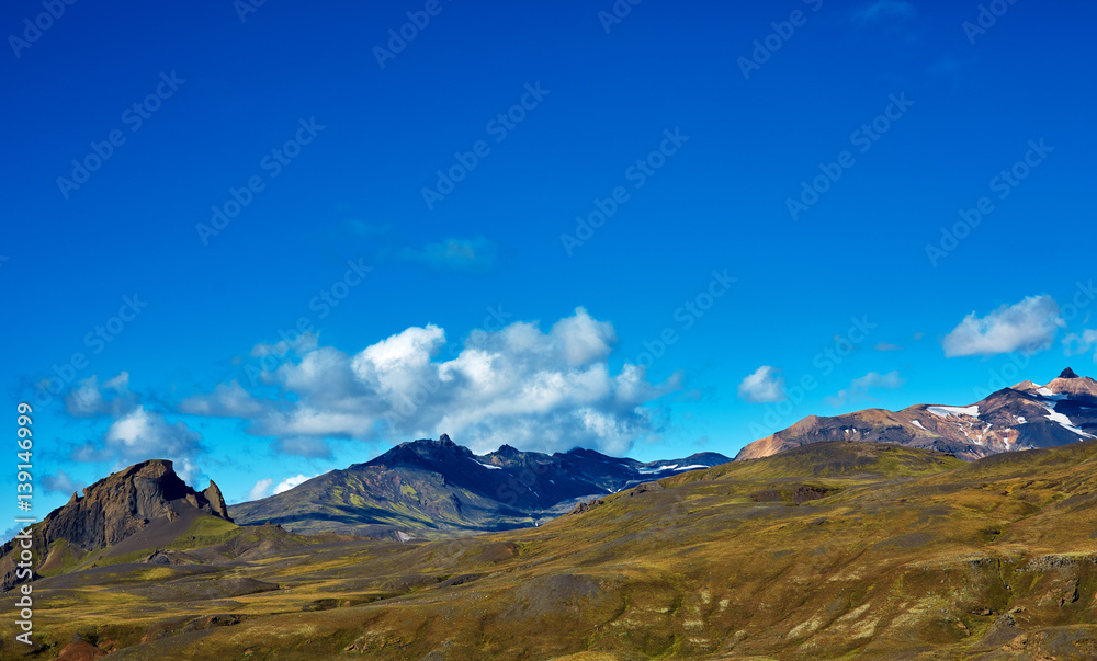 Travel to Iceland. Beautiful Icelandic landscape with mountains, sky and clouds. Trekking in national park Landmannalaugar