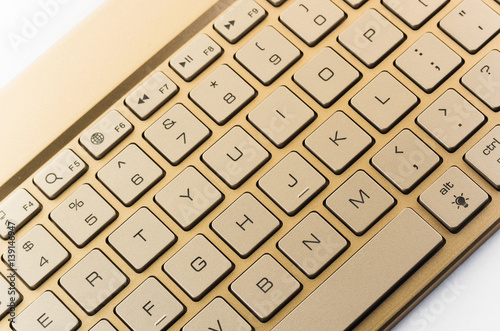 Gold keyboard on a white background