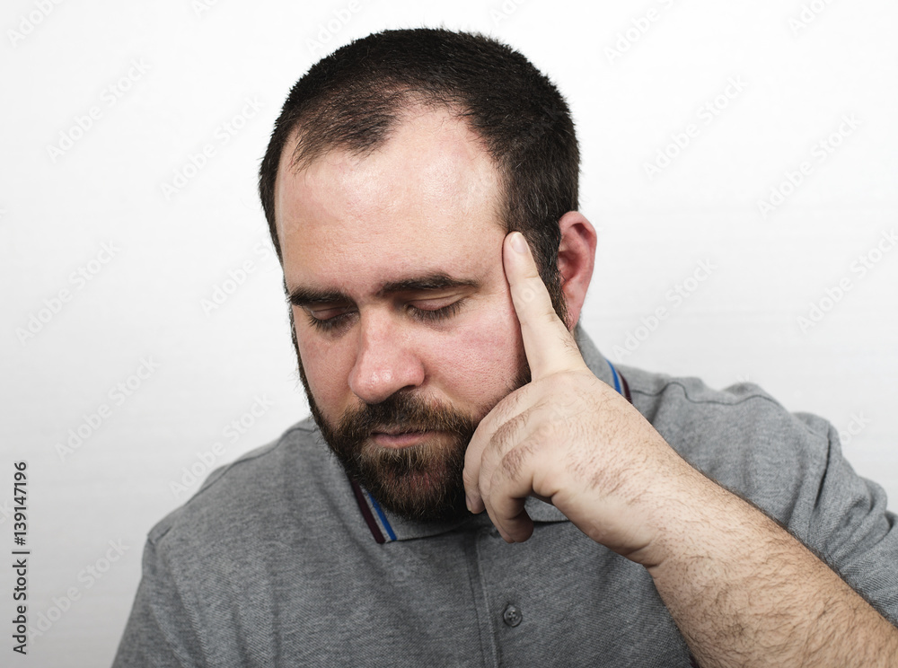 Fototapeta premium Young man with beard with serious gesture. Isolated.