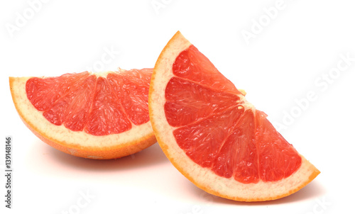 pieces of grapefruit on wood on white