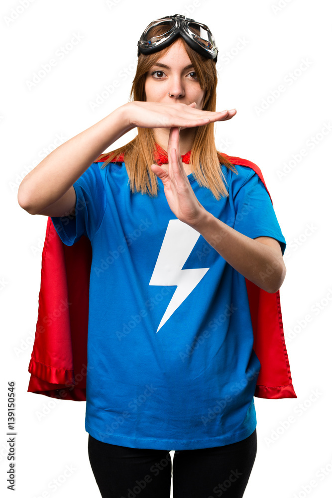 Pretty superhero girl making time out gesture Pretty superhero girl making time out gesture