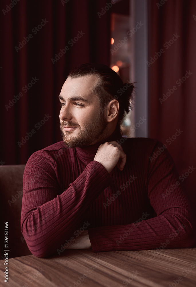 Elegant brutal handsome man sitting in cafe Elegant brutal handsome man sitting in cafe