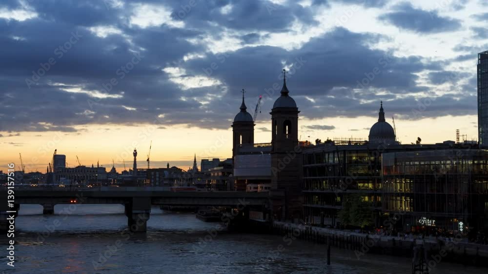 Sunset day to night TIme-Lapse Hyper-Lapse at Cannon Street Station in London during the Summer. St Paul's Cathedral is in the background.
Red clouds, dolly movement to the left. Sunset day to night TIme-Lapse Hyper-Lapse at Cannon Street Station in London during the Summer. St Paul's Cathedral is in the background.
Red clouds, dolly movement to the left.