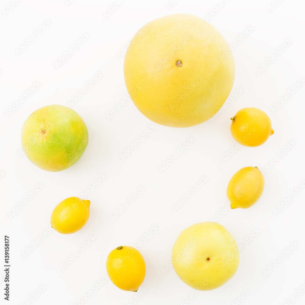 Citrus fruits frame of lemon, sweetie and pomelo on white background. Flat lay, top view. Fruit's background Citrus fruits frame of lemon, sweetie and pomelo on white background. Flat lay, top view. Fruit's background
