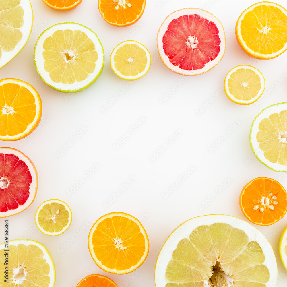 Frame of citrus fruits on white background. Flat lay, top view. Fruit's background