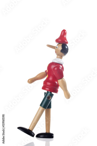 Wooden Pinocchio doll isolated on white background.