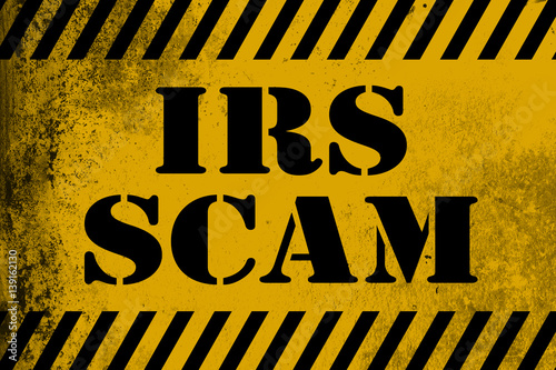 IRS scam sign yellow with stripes