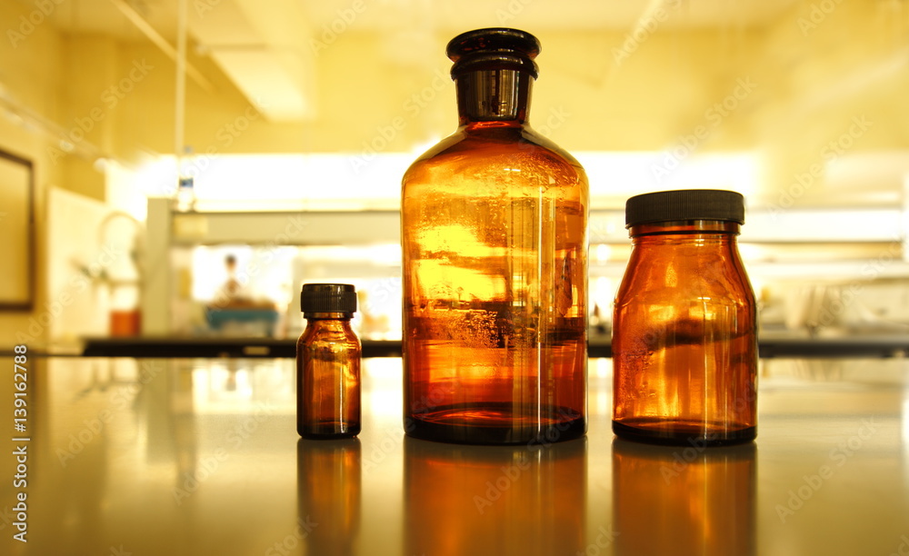 retro three brown bottle in science laboratory retro three brown bottle in science laboratory