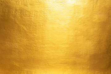 Gold concrete wall on background texture.