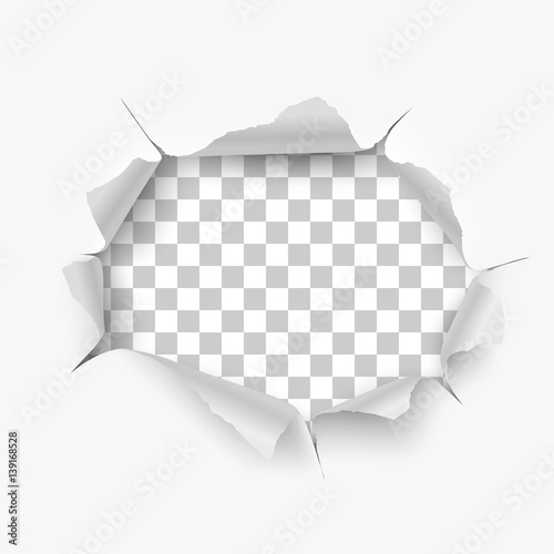 Torn hole and ripped of paper on a transparent background photo