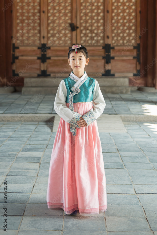 Beautiful Korean girl in Hanbok at Gyeongbokgung, the traditional Korean dress.