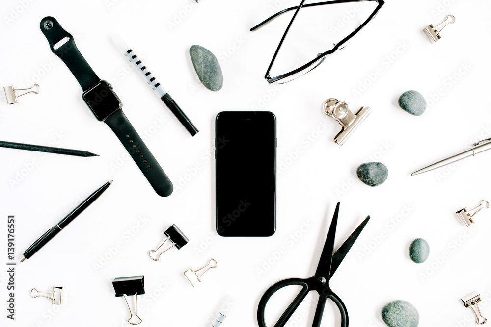 White office desk with supplies. mobile phone, glasses, scissors and office supplies on white background. Flat lay, top view office table desk. White office desk with supplies. mobile phone, glasses, scissors and office supplies on white background. Flat lay, top view office table desk.
