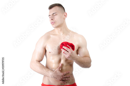 Fotografi Sexy athletic man washes.