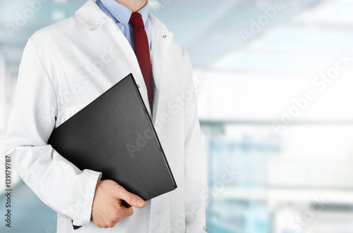 Doctor with documents in hospital photo