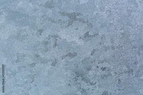 Abstract Texture background of frost rime ice pattern on glass window during winter in Europe photo