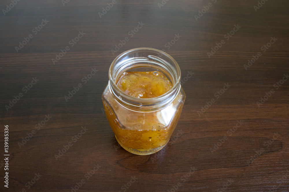 Gooseberry jam in a glass jar.