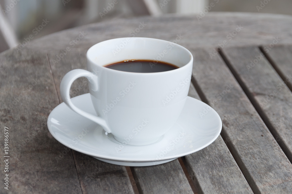 white cup of coffee on wooden table, soft focus white cup of coffee on wooden table, soft focus