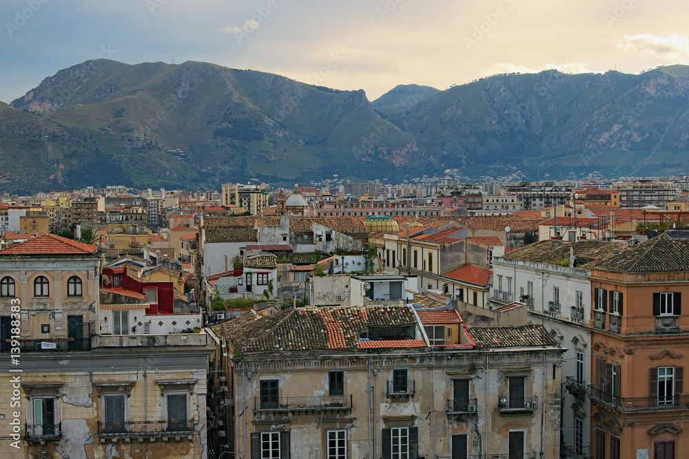 View from the roof of Palermo Cathedral. You can see amazing cityscape of Palermo. Beautiful tiled roofs of old houses. Nice mountain in the background. Palermo. Sicily
