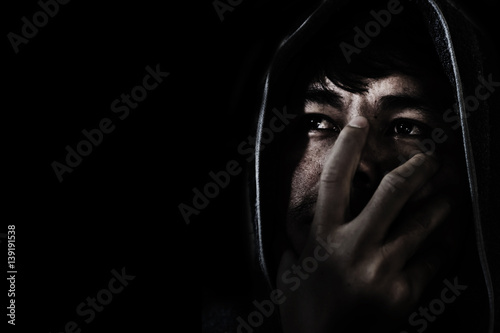 Εκτύπωση καμβά man in head scarf, depressed and hopeless in the dark