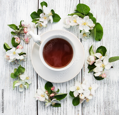 cup of tea with apple blossoms