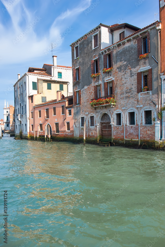 Old houses by Canal Grande in a summer day in Venice