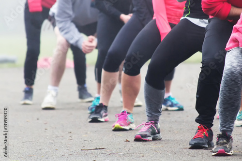 People doing keep fit exercise in park