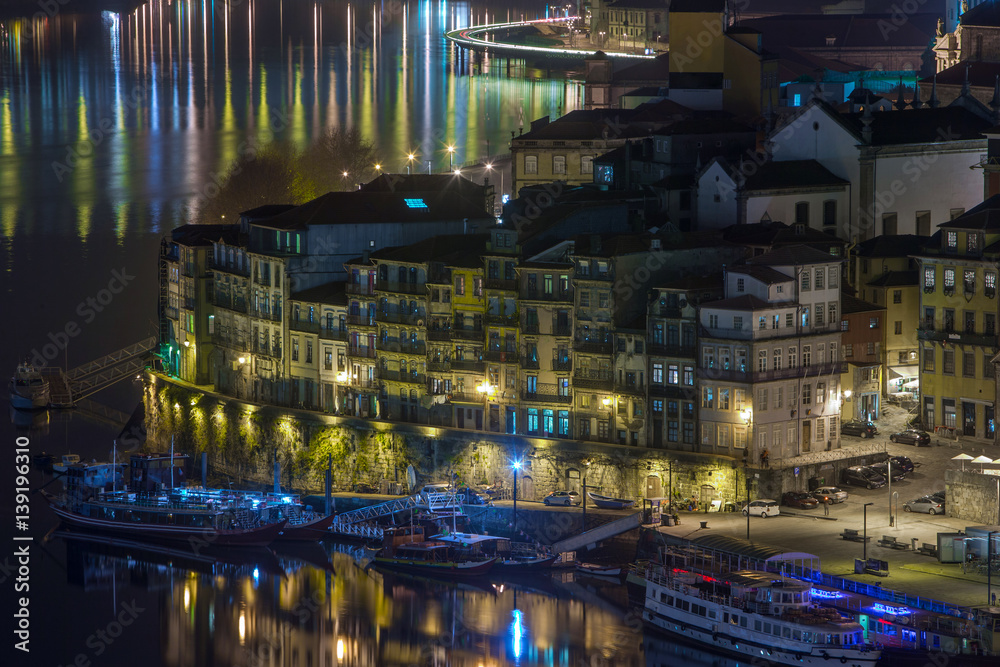 night cityscape view city of Porto and Douro river in Portugal