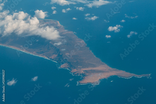 Idyllic azure peninsula coast with bald mountain peaks