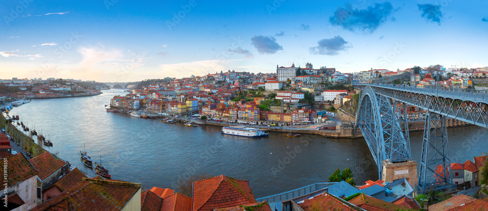 Wide angle Panorama of old town Porto, Portugal. Douro river and the Dom Luis Bridge.