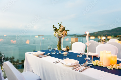 Romantic dinner setting  at sunset