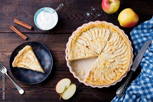 Apple pie, tart on a wooden background. Top view.