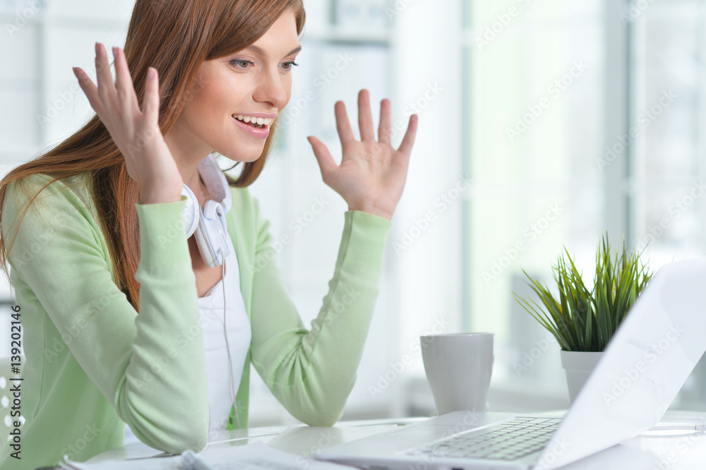 Beautiful girl working at a laptop